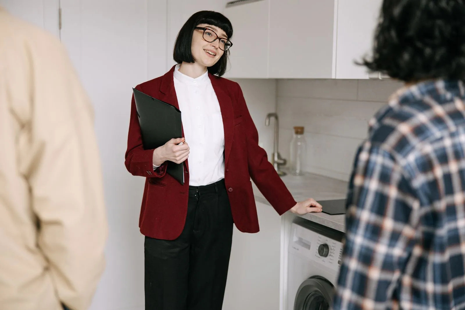 A property agent shows clients an apartment.